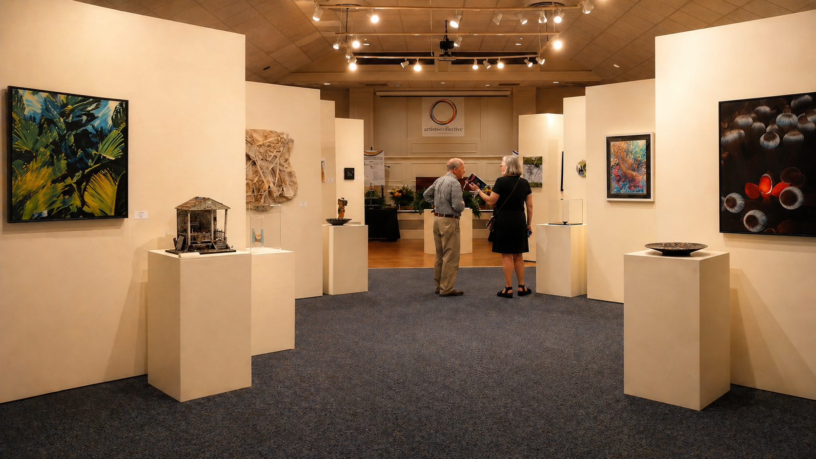 Art gallery interior with visitors viewing artwork